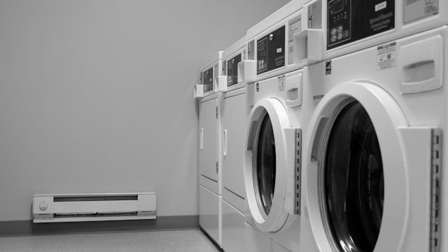 Row of clothes washers and dryers